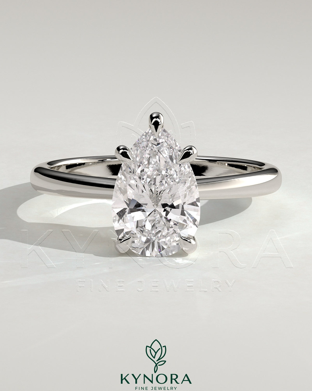 Kynora CJ 2ct pear-shaped diamond solitaire engagement ring with pinched tapered band and cathedral low setting.