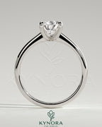 Kynora CJ 2ct pear-shaped diamond solitaire engagement ring with pinched tapered band and cathedral low setting.