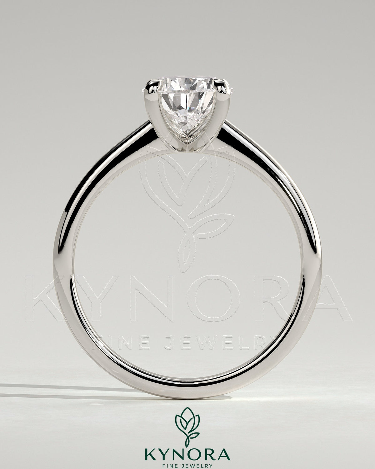 Kynora CJ 2ct pear-shaped diamond solitaire engagement ring with pinched tapered band and cathedral low setting.