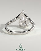Kynora CJ 2ct pear-shaped diamond solitaire engagement ring with V-shaped band, crafted in elegant jewelry style.