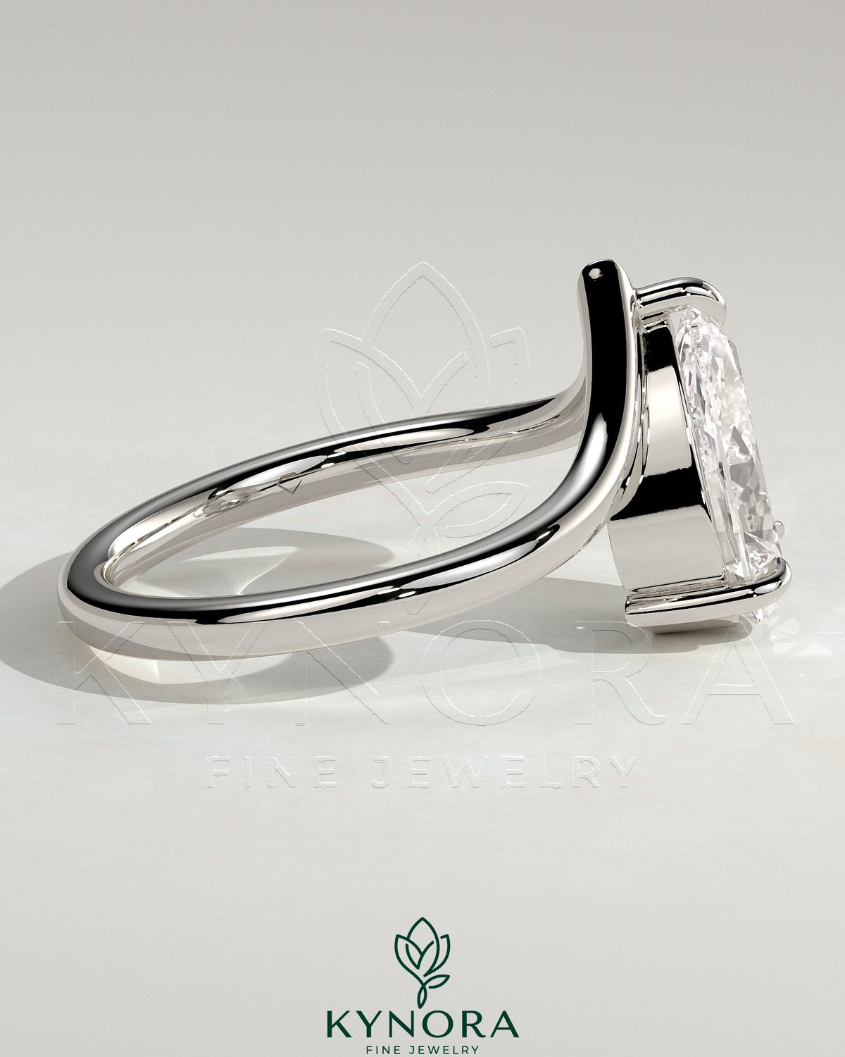 Kynora CJ 2ct pear-shaped diamond solitaire engagement ring with V-shaped band, elegant and sparkling jewelry.