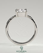 Kynora CJ 2ct pear-shaped diamond solitaire engagement ring with V band design, featuring a sleek, elegant jewelry setting.