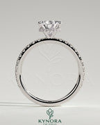 Kynora CJ 2ct pear-shaped diamond solitaire engagement ring with wrap-around hidden halo and pavé band, five-prong setting