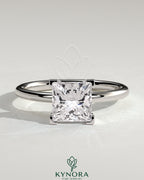 Kynora CJ 2ct princess cut solitaire engagement ring with a sleek band, showcasing a sparkling princess gemstone on a polished setting.