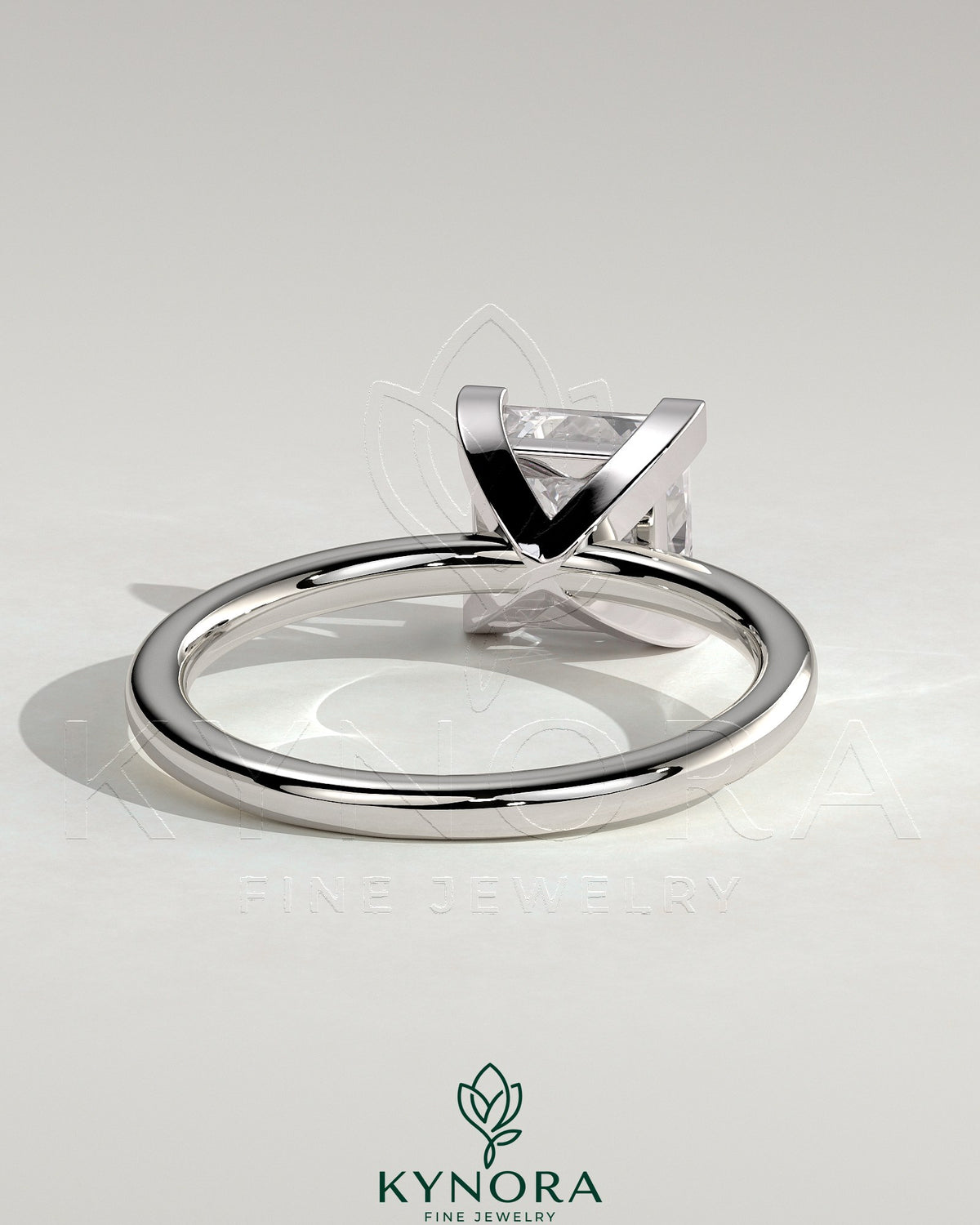 Kynora CJ 2-carat princess cut solitaire engagement ring with a sleek band and sparkling center stone on a white background.