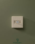 Kynora CJ 2ct princess claw solitaire engagement ring featuring a sparkling central diamond and a sleek band.