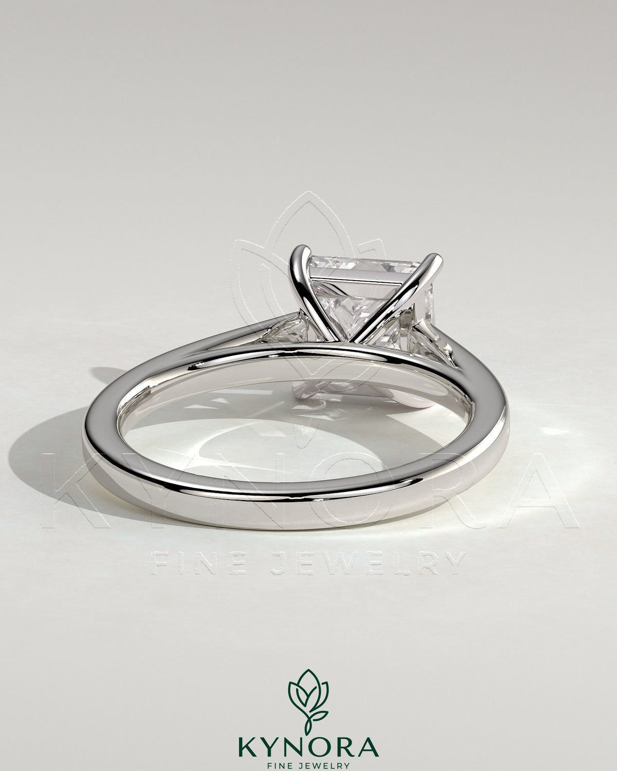 Kynora CJ 2ct princess cut solitaire engagement ring with flat band and cathedral high setting, showcasing elegant jewelry design.