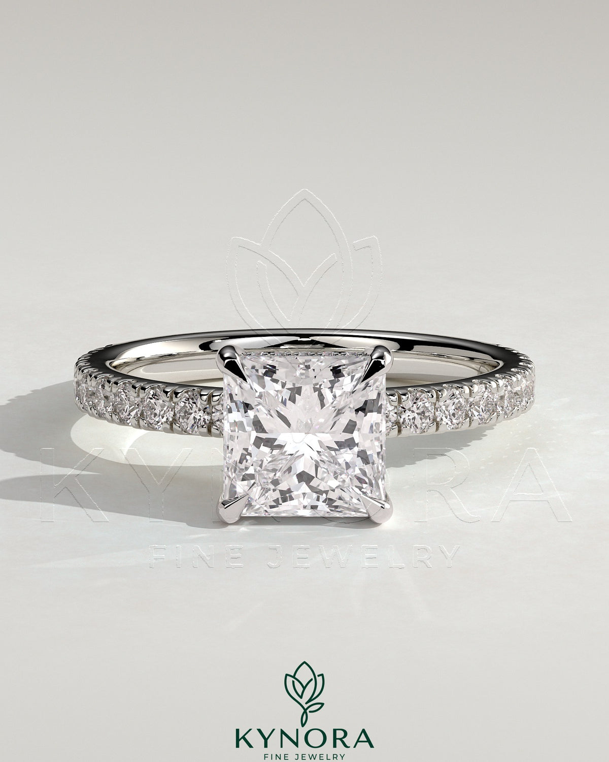 Kynora CJ 2ct princess cut solitaire engagement ring with hidden halo and pave band, showcasing elegant diamond setting. Main image
