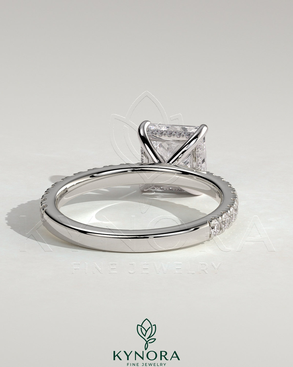 Kynora CJ 2ct princess cut solitaire engagement ring with hidden halo and pave band, showcasing elegant diamond design.