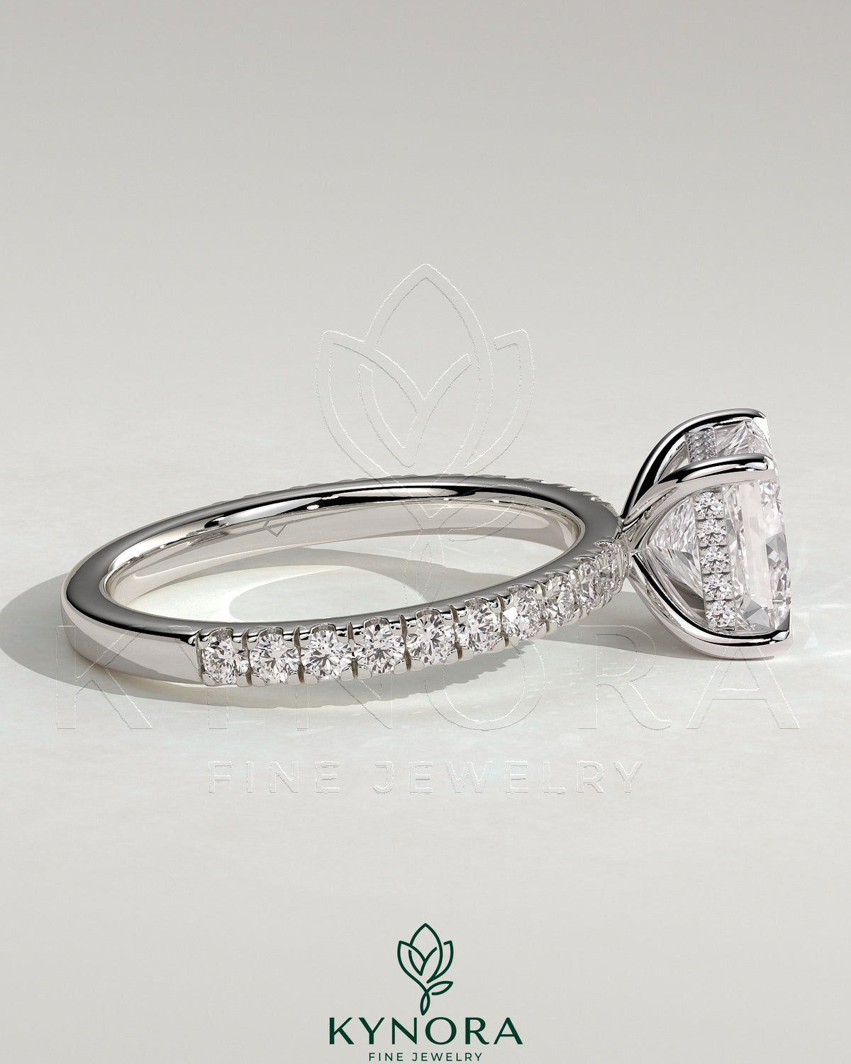 Kynora CJ 2ct princess claw solitaire engagement ring with hidden halo and pave band, featuring a sparkling center stone and elegant design.