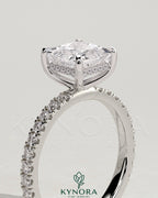 Kynora CJ 2ct princess claw solitaire engagement ring with hidden halo and pave band, showcasing a sparkling diamond setting.