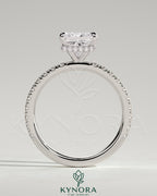 Kynora CJ 2ct princess claw solitaire engagement ring with wrap-around hidden halo and pavé band, showcasing sparkling diamond details.