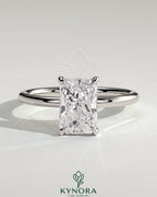 Kynora CJ 2ct radiant cut diamond solitaire engagement ring featuring a claw setting on a sleek band.