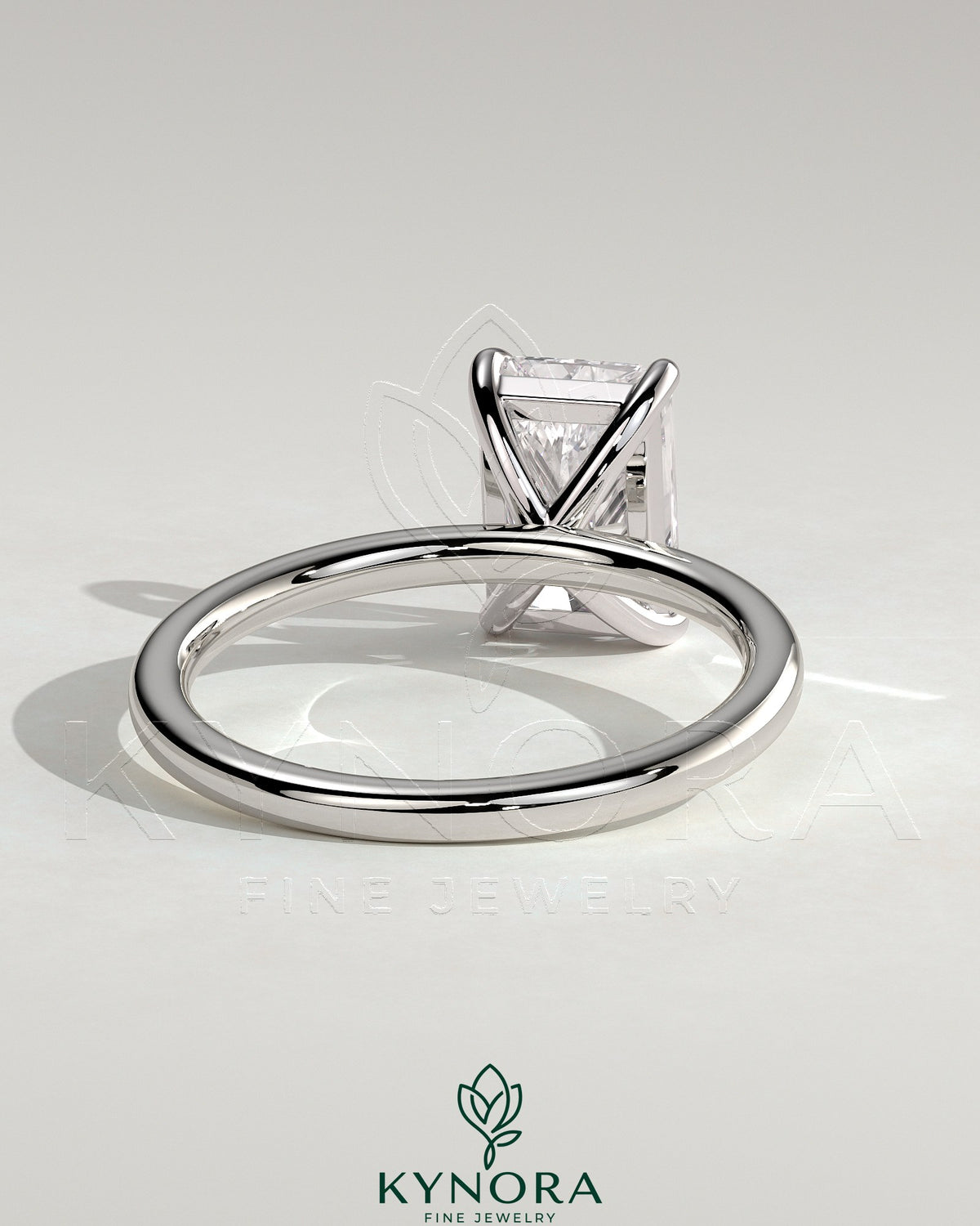 Kynora CJ 2ct radiant cut diamond claw solitaire engagement ring with a sleek band and sparkling center stone.
