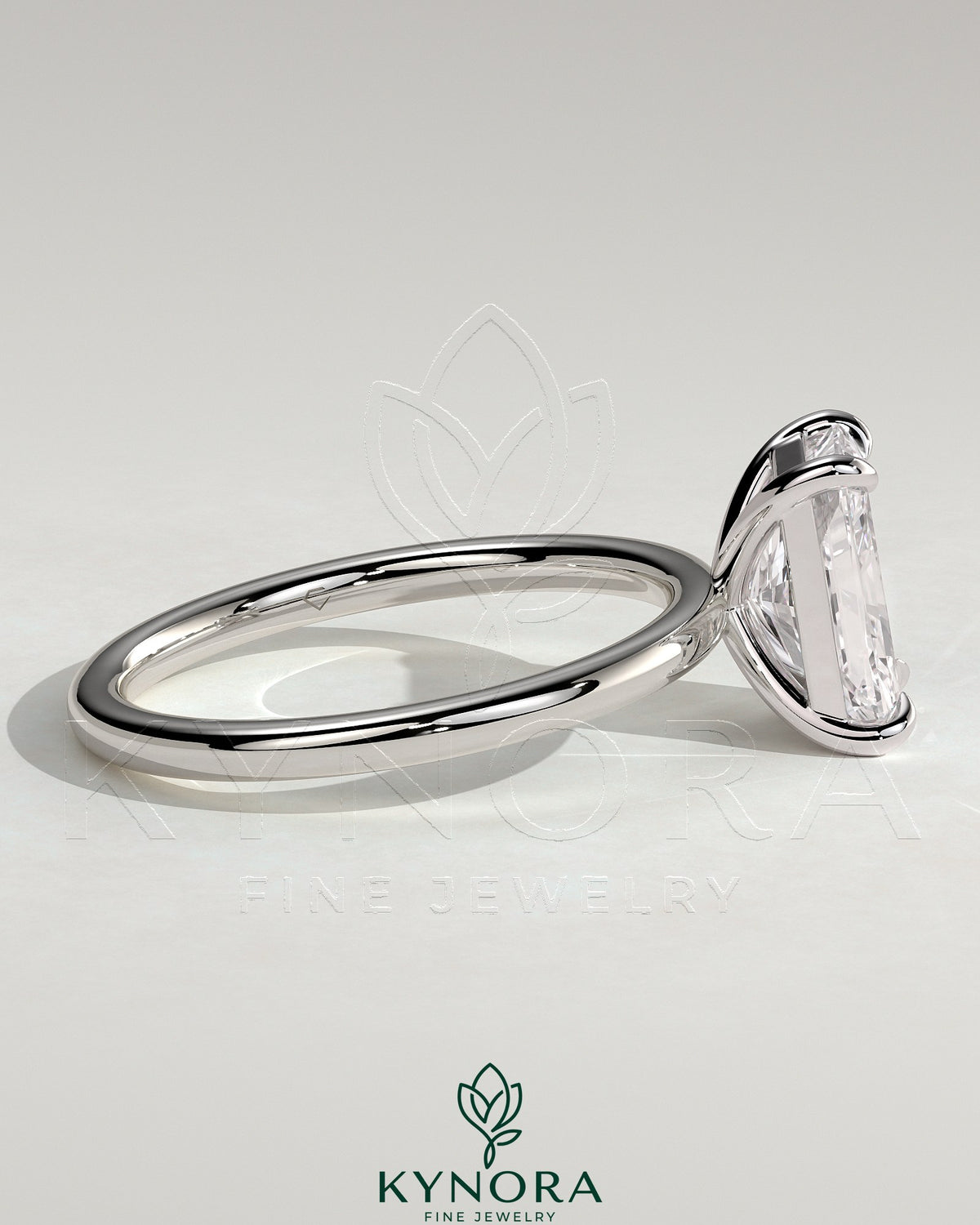 Kynora CJ 2ct radiant cut solitaire engagement ring with claw setting, showcasing a sparkling central diamond on a sleek band.