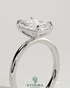 Kynora CJ 2ct radiant cut solitaire engagement ring with a claw setting showcasing a large sparkling diamond.