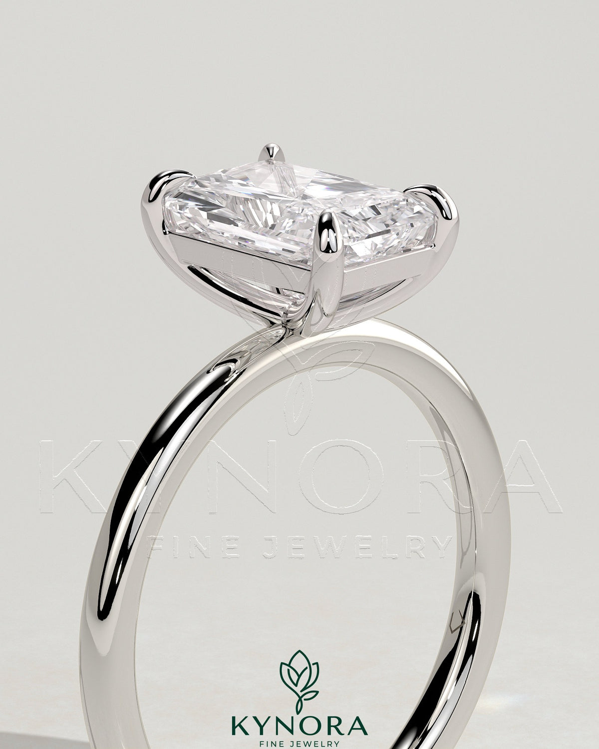 Kynora CJ 2ct radiant cut solitaire engagement ring with a claw setting showcasing a large sparkling diamond.