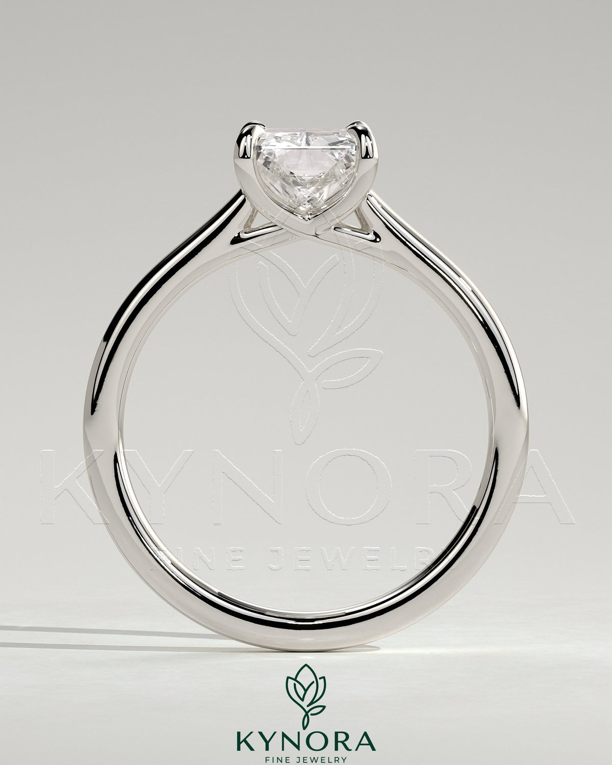 Kynora CJ 2ct radiant cut diamond solitaire engagement ring with cathedral low setting and open trellis gallery design.