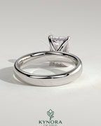 Kynora CJ 2ct radiant diamond claw solitaire engagement ring with cigar band and hidden halo, crafted in elegant jewelry design.
