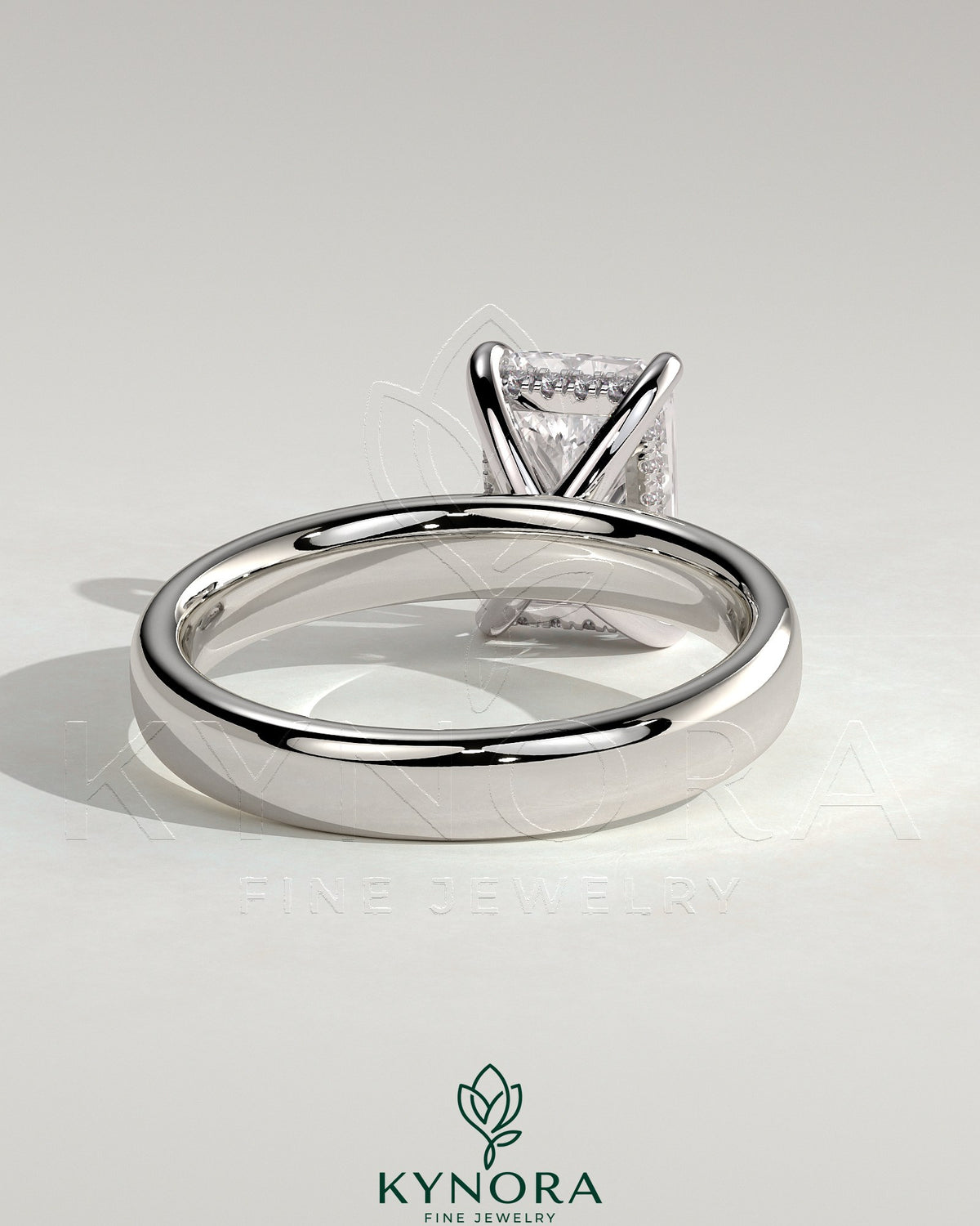 Kynora CJ 2ct radiant diamond claw solitaire engagement ring with cigar band and hidden halo, crafted in elegant jewelry design.
