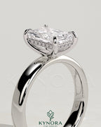 Kynora CJ 2ct radiant diamond claw solitaire engagement ring with cigar band and hidden halo design.
