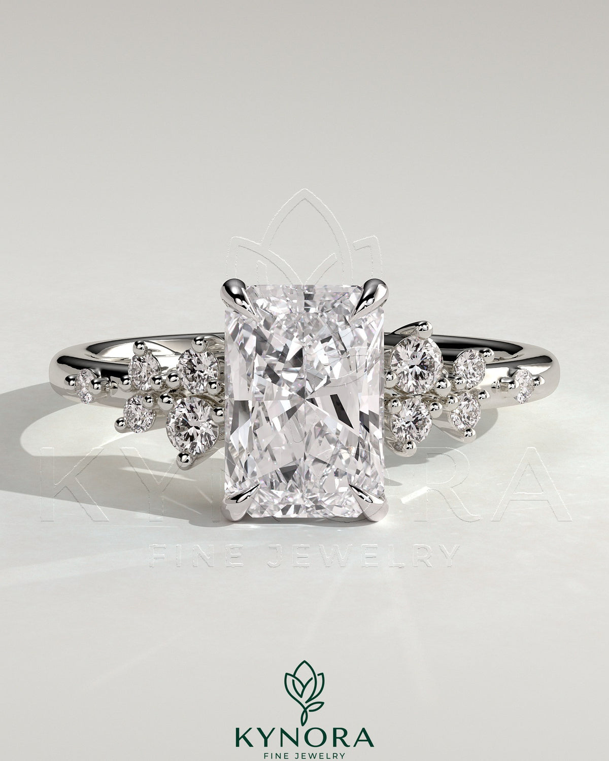 Kynora CJ 2ct radiant claw solitaire engagement ring with clustered round shoulder stones, elegant solitaire ring design.