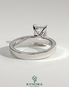 Kynora CJ 2ct radiant diamond claw solitaire engagement ring with flat cigar band and hidden halo setting.