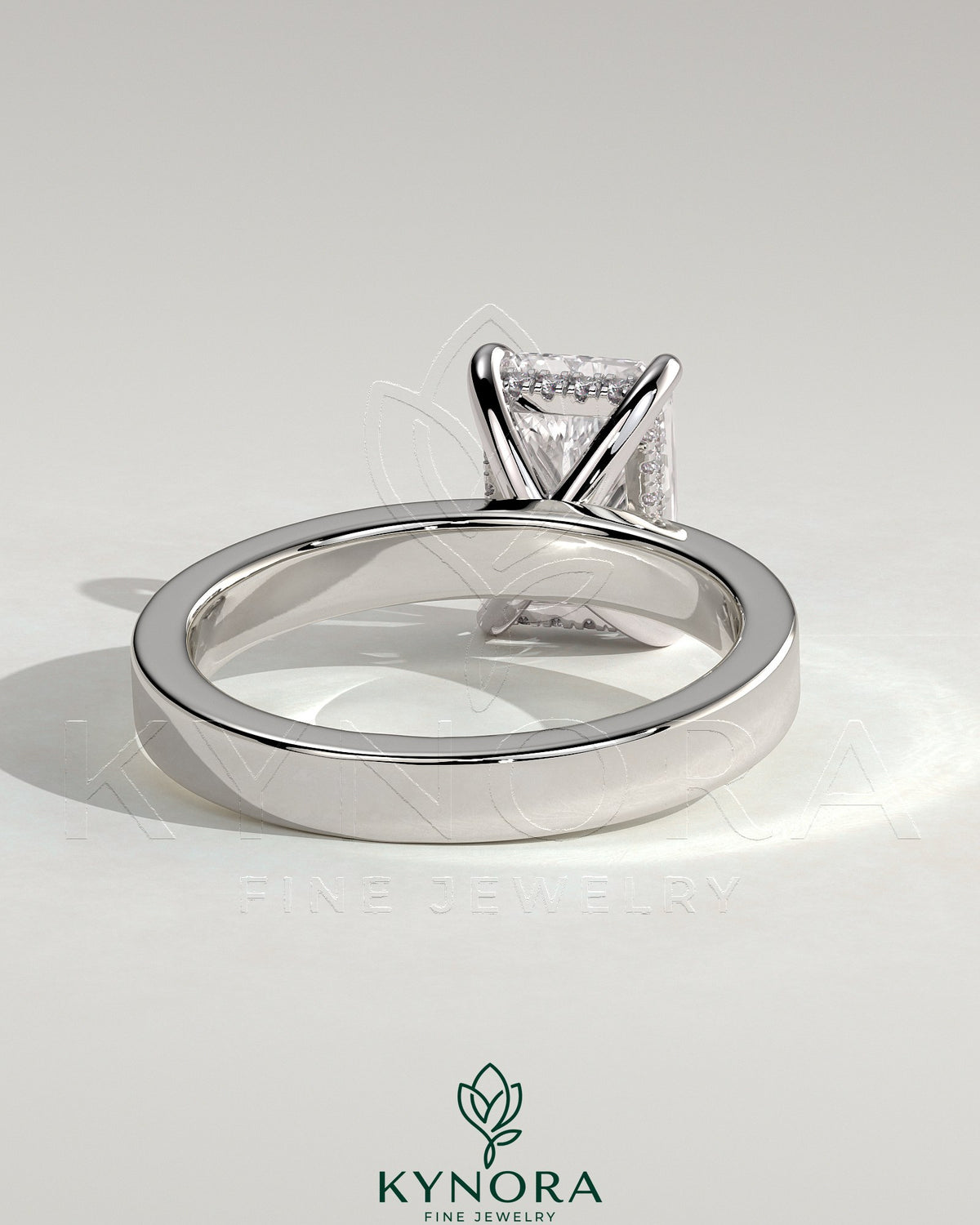 Kynora CJ 2ct radiant diamond claw solitaire engagement ring with flat cigar band and hidden halo setting.