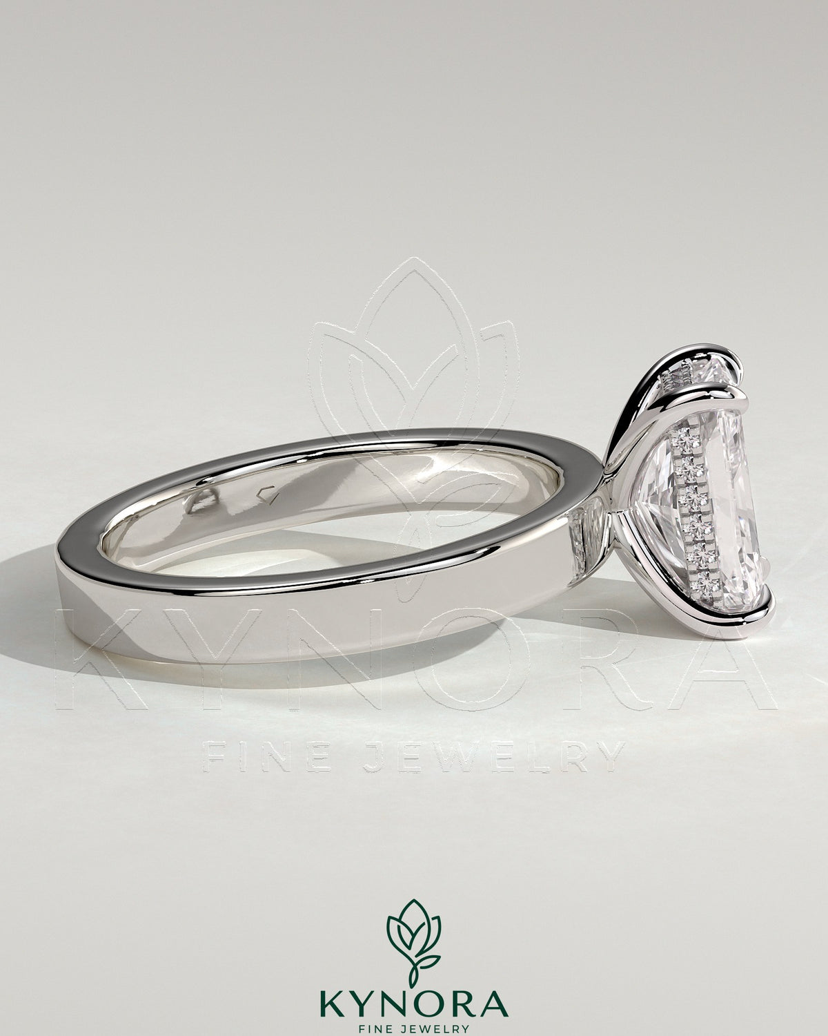 Kynora CJ 2ct radiant claw solitaire engagement ring with flat cigar band and hidden halo, showcasing sparkling diamond details.