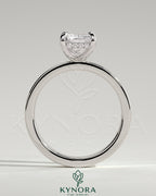 Kynora CJ 2ct radiant claw solitaire engagement ring with flat cigar band and hidden halo, showcasing a sparkling center stone.