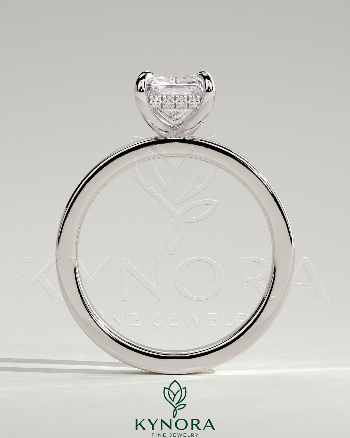 Kynora CJ 2ct radiant claw solitaire engagement ring with flat cigar band and hidden halo, showcasing a sparkling center stone.