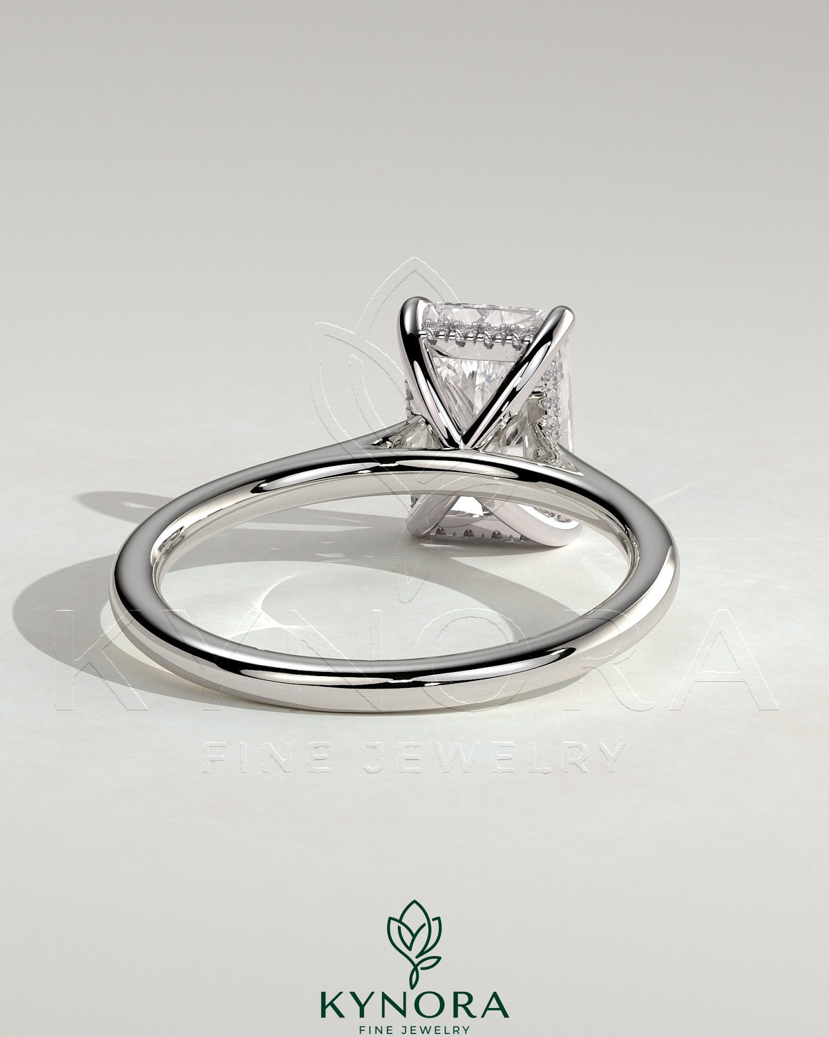 Kynora CJ 2ct radiant diamond solitaire engagement ring with hidden halo and cathedral high setting, showcasing intricate craftsmanship.