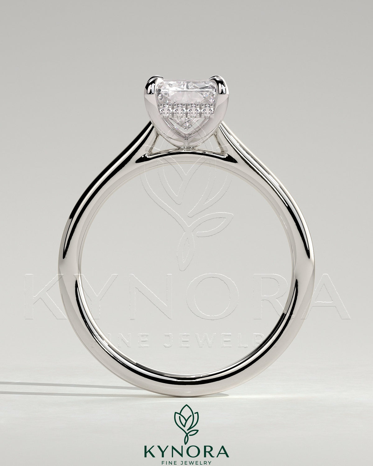 Kynora CJ 2ct radiant claw solitaire engagement ring with hidden halo and cathedral high setting, showcasing intricate diamond details.
