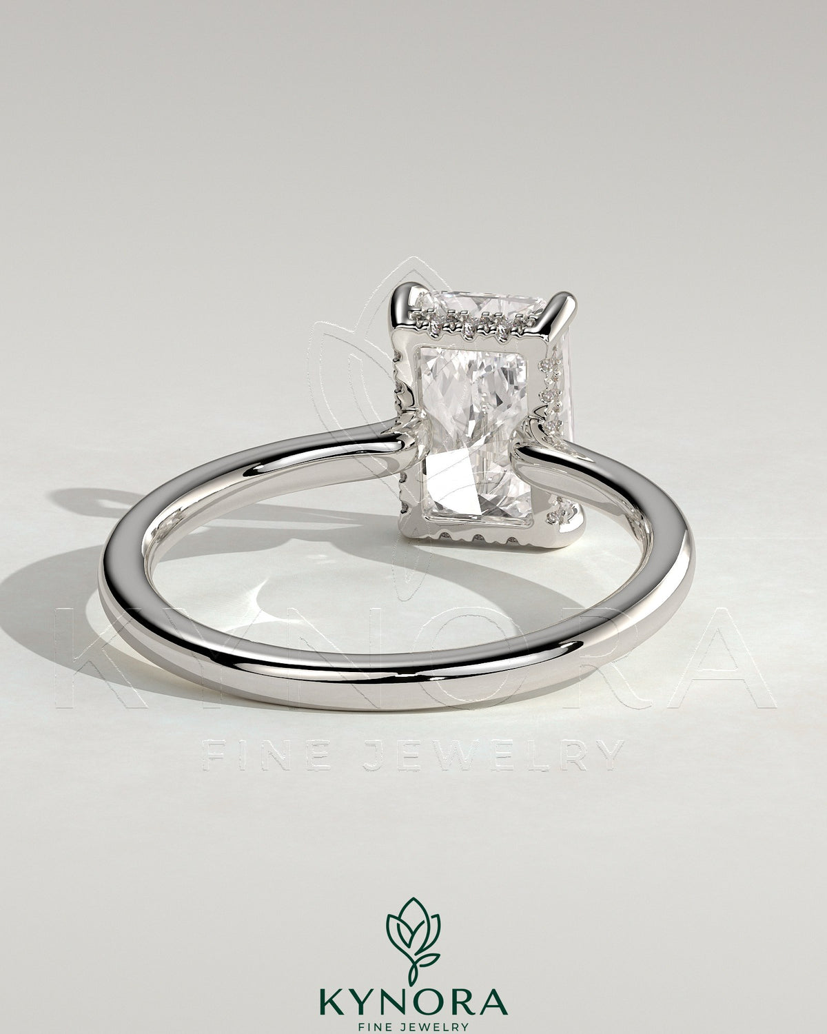 Kynora CJ 2ct radiant claw solitaire engagement ring with hidden halo and floating cathedral low setting, showcasing the detailed design.