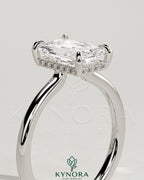 Kynora CJ 2ct radiant claw solitaire engagement ring with hidden halo and floating cathedral low setting, showcasing intricate design details.