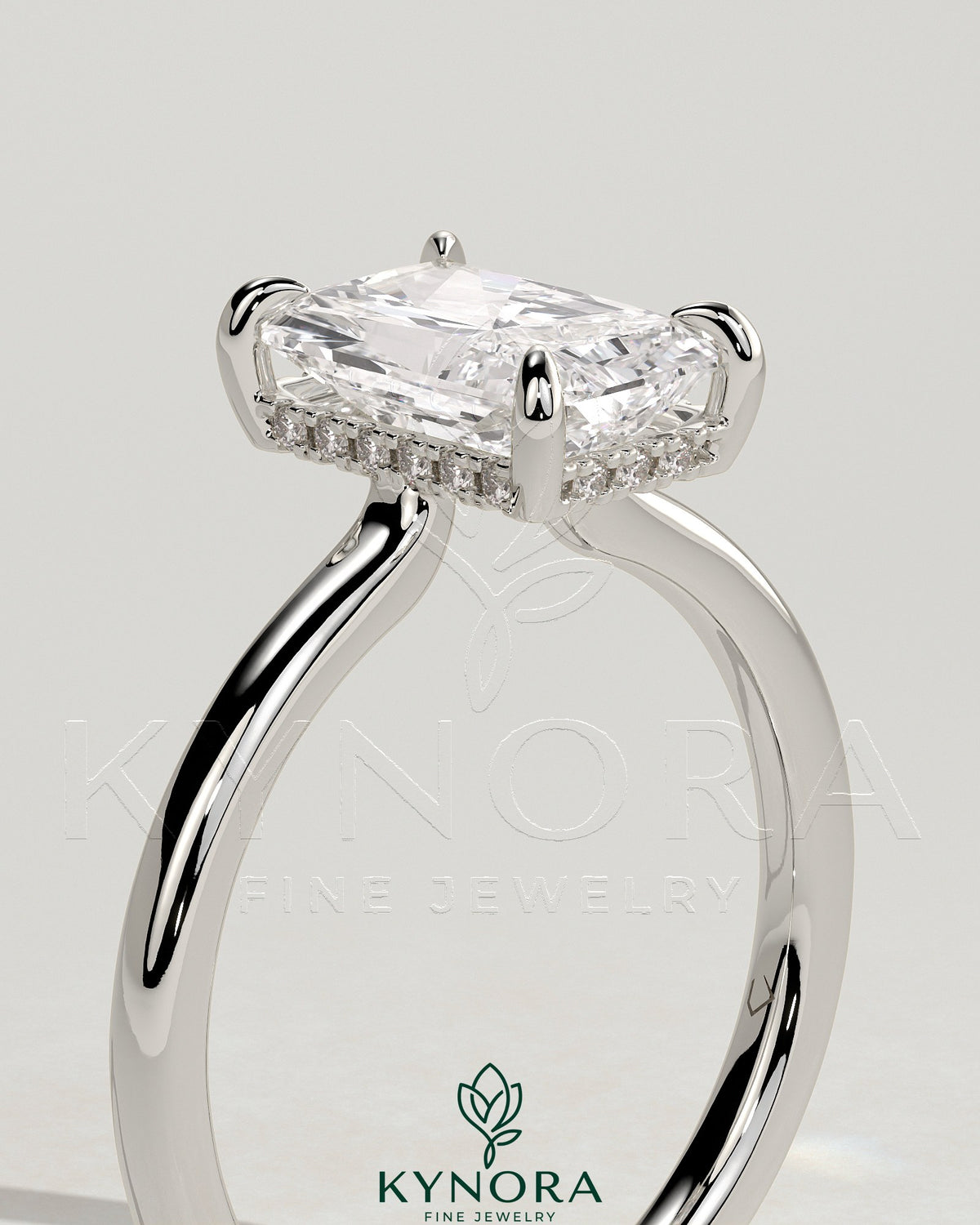 Kynora CJ 2ct radiant claw solitaire engagement ring with hidden halo and floating cathedral low setting, showcasing intricate design details.