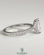 Kynora CJ 2ct radiant diamond claw solitaire engagement ring with hidden halo and pave band, elegant and sparkling jewelry piece.