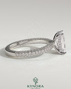 Kynora CJ 2ct radiant claw solitaire engagement ring with hidden halo and triple pave band, showcasing elegant diamond craftsmanship.