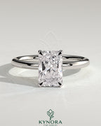Kynora CJ 2ct radiant cut solitaire engagement ring with hidden halo and claw setting, featuring sparkling diamond details.