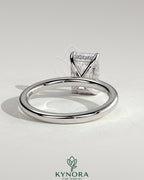Kynora CJ 2ct radiant cut solitaire engagement ring with hidden halo design, featuring a sparkling diamond setting and elegant band.