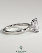 Kynora CJ 2ct radiant claw solitaire engagement ring with hidden halo, featuring a sparkling center stone and elegant design.