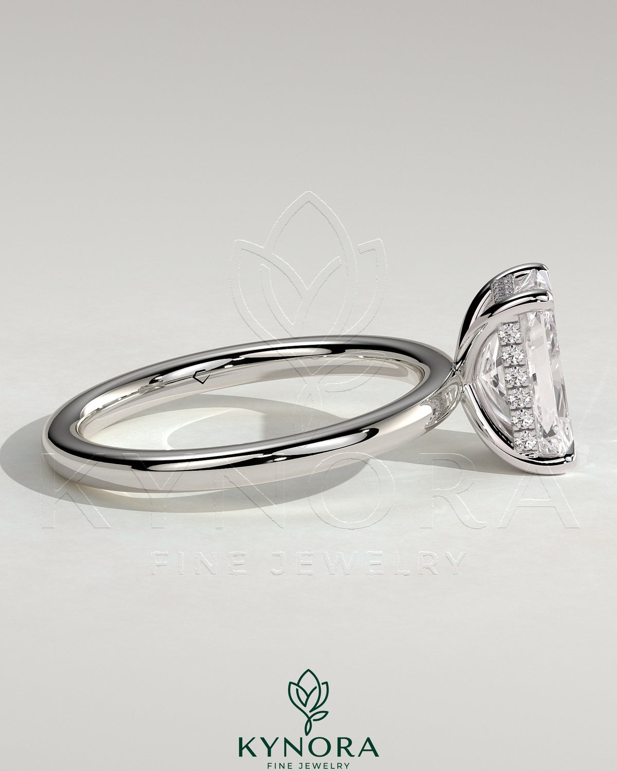 Kynora CJ 2ct radiant claw solitaire engagement ring with hidden halo, featuring a sparkling center stone and elegant design.