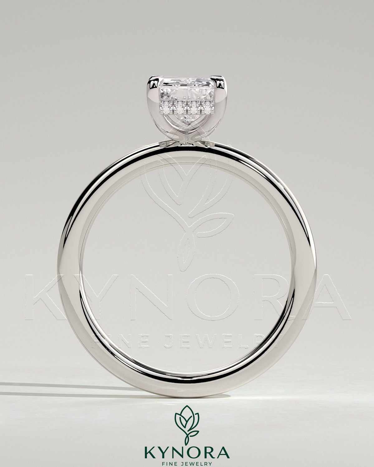 Kynora CJ 2ct radiant claw solitaire engagement ring with hidden halo, featuring a sparkling central diamond and elegant band.