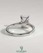 Kynora CJ 2ct radiant cut solitaire engagement ring with hidden halo, pave band, and cathedral high setting.