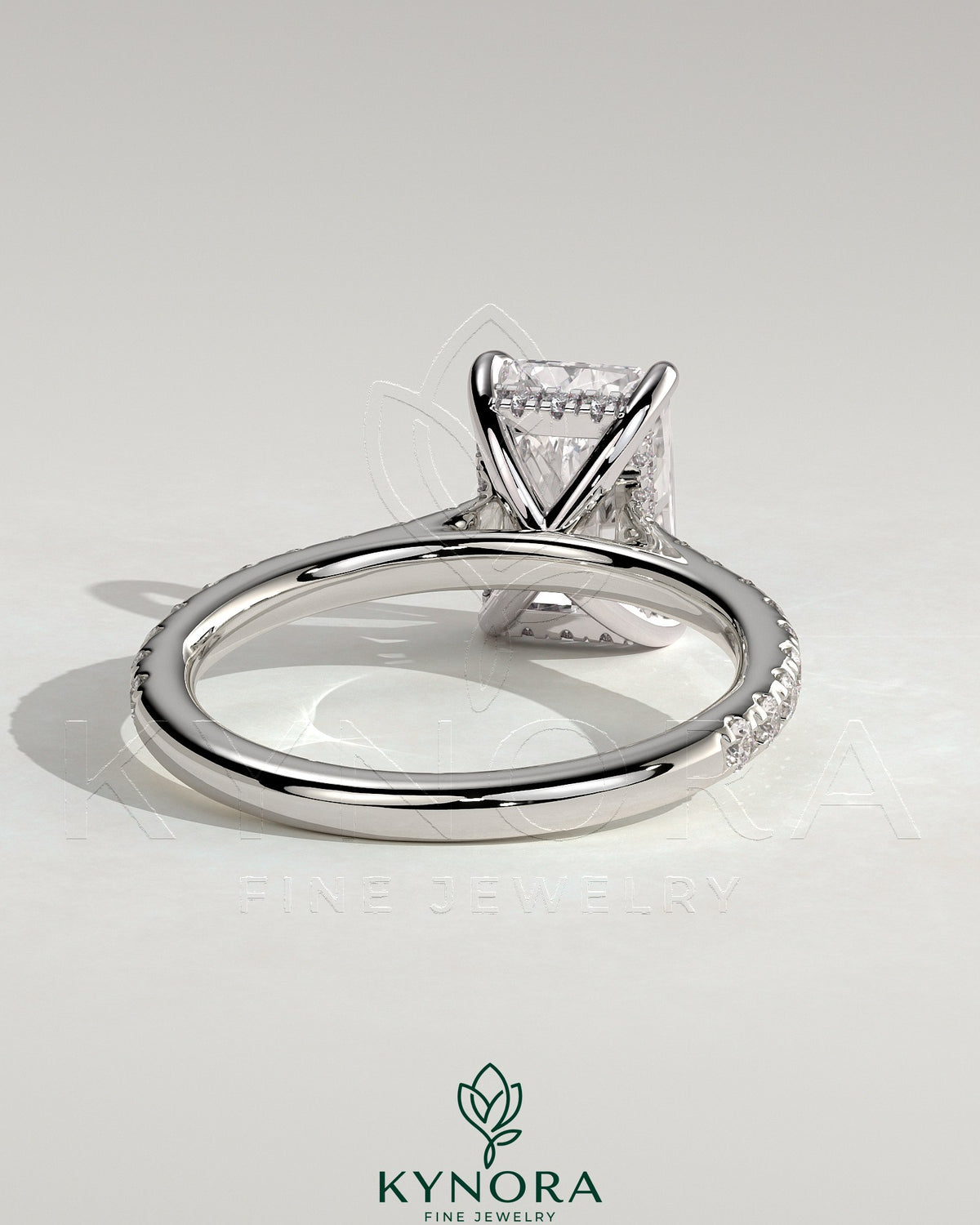 Kynora CJ 2ct radiant cut solitaire engagement ring with hidden halo, pave band, and cathedral high setting.
