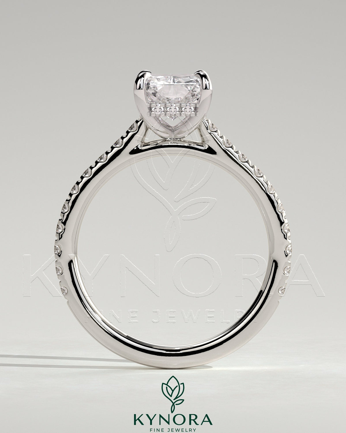 Kynora CJ 2ct radiant diamond solitaire engagement ring with hidden halo, pave band, and cathedral high setting.