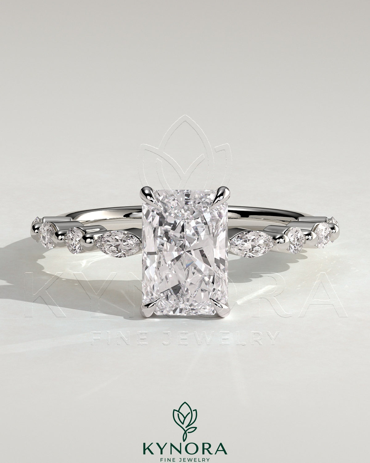 Kynora CJ 2ct radiant claw solitaire engagement ring with marquise and round accent stones, showcasing a sparkling elegant design. Main image