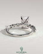 Kynora CJ 2ct radiant claw solitaire engagement ring with marquise and round accent stones, elegant and sparkling jewelry design