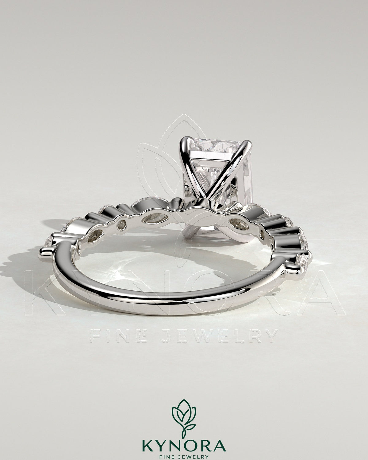 Kynora CJ 2ct radiant claw solitaire engagement ring with marquise and round accent stones, elegant and sparkling jewelry design