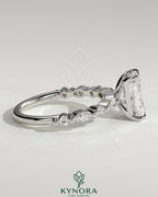 Kynora CJ 2ct radiant claw solitaire engagement ring with marquise and round accent stones on a silver band